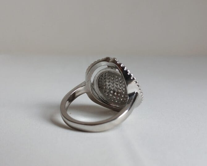SS RING WITH CZS I SIDE