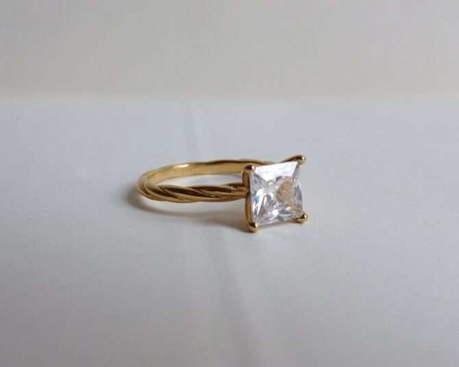 Gold-plated engagement band in real zirconia setting all around